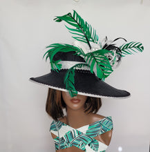 Black Wide Brim Sinamay Hat adorned in green and white embellishments